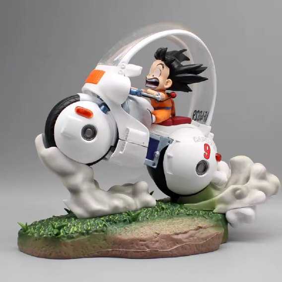 Figura Diorama Goku Niño en Moto del Futuro Hovercraft Dragon Ball 22cm - Moto blanca #9 sobre base de hierba con efectos de viento